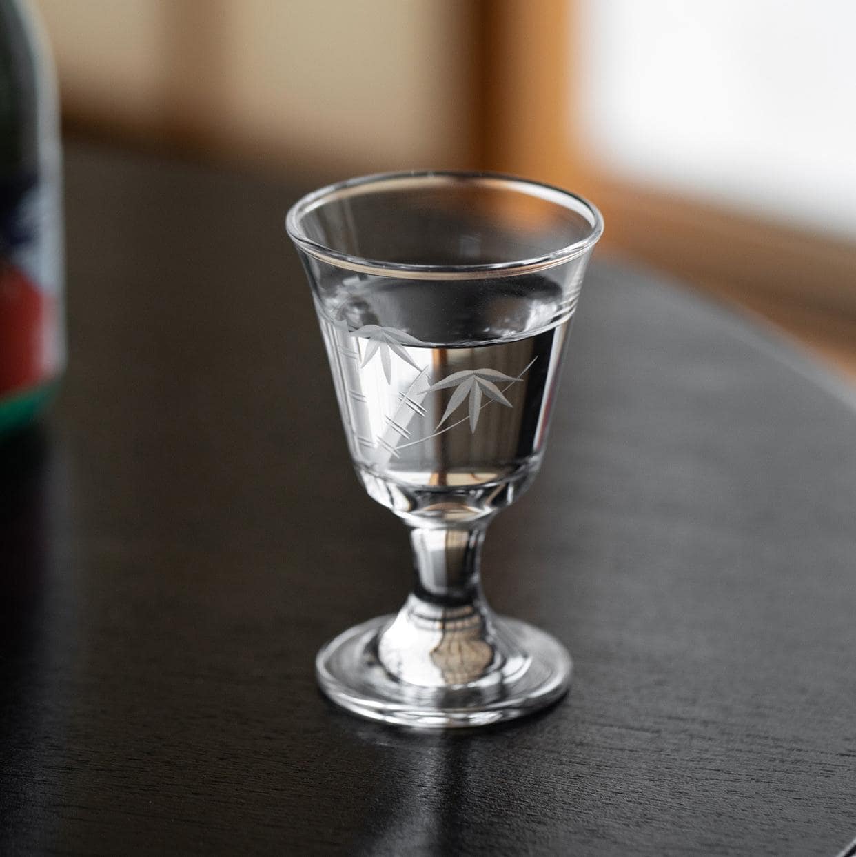 Premium crystal stemmed glass with wine being poured