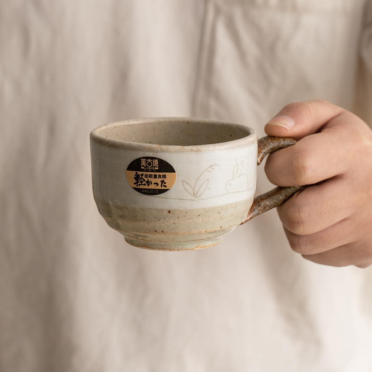 Close-up of Japanese Wan Gu Yao rabbit ceramic mug.