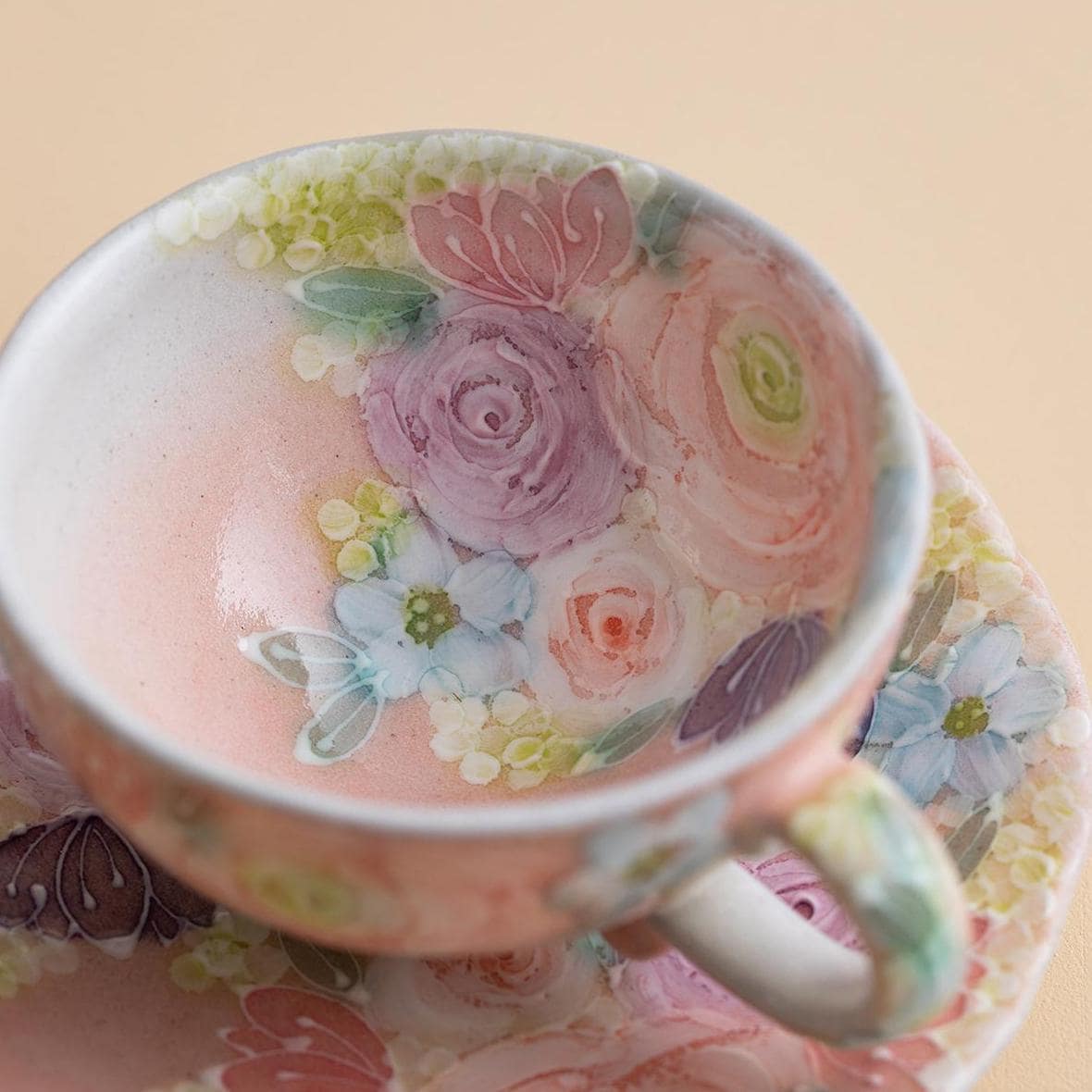 Delicate Japanese tea cup featuring a unique floral design