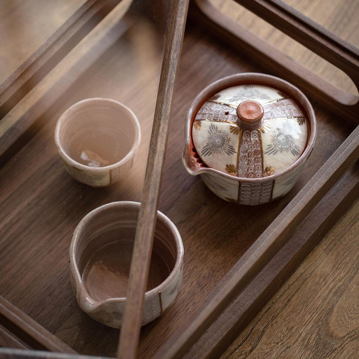 Close-up of a detailed Nishikawa Sadazaburo ceramic fair cup.