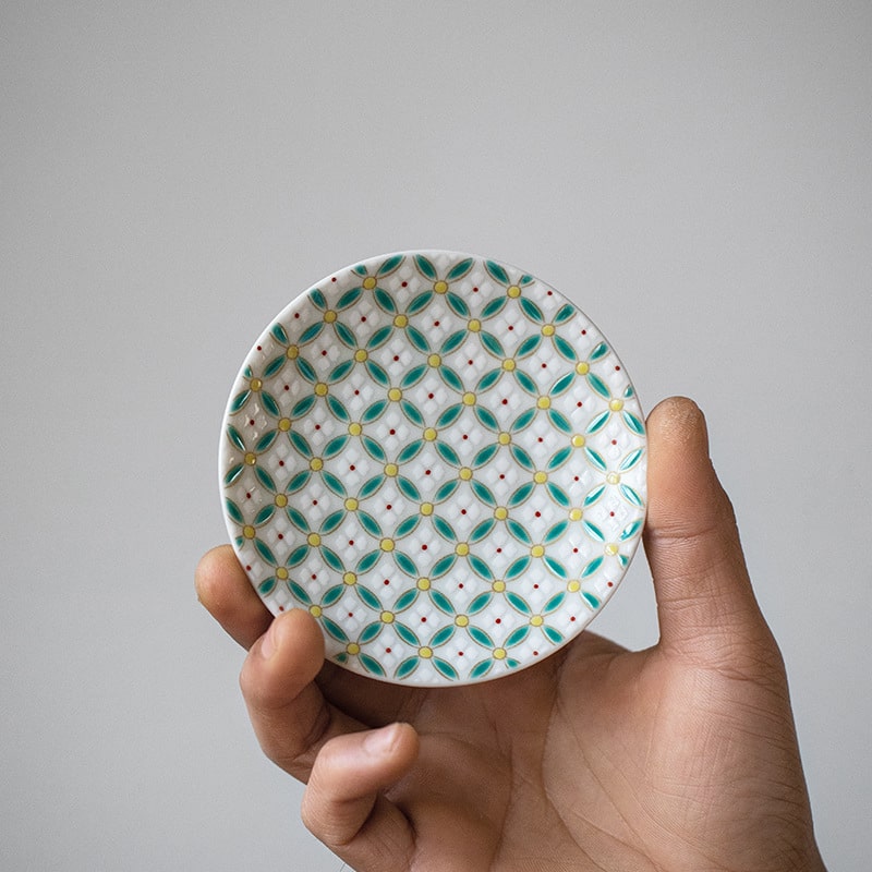 Close-up of a stylish ceramic cup showcasing intricate geometric designs.