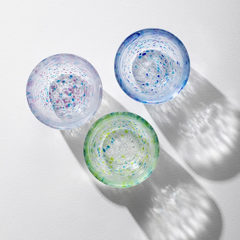 Close-up of vibrant handcrafted glass cup design.