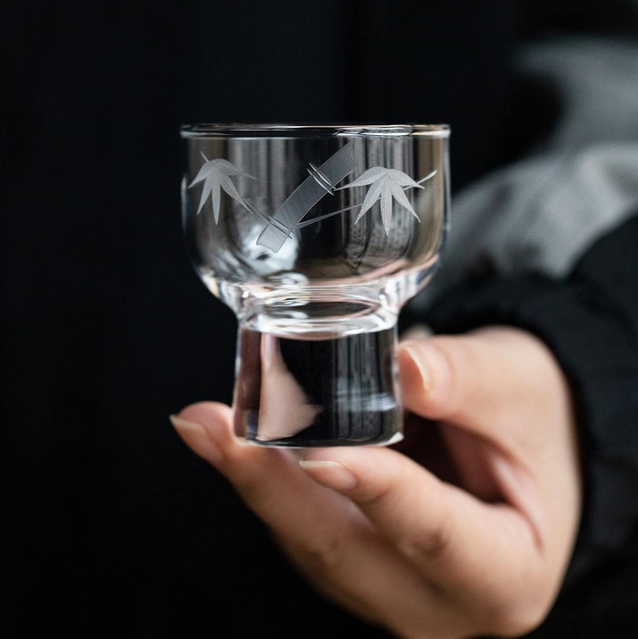 Close-up of floral etched pattern on crystal wine glass