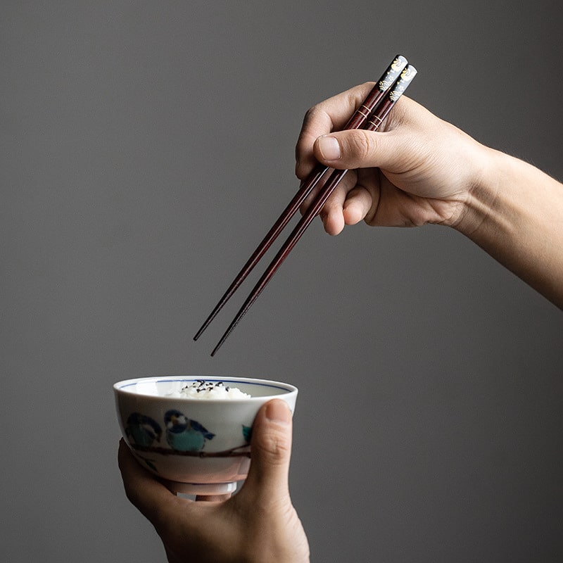 Elegant chopstick set with decorative gold details on a table setting