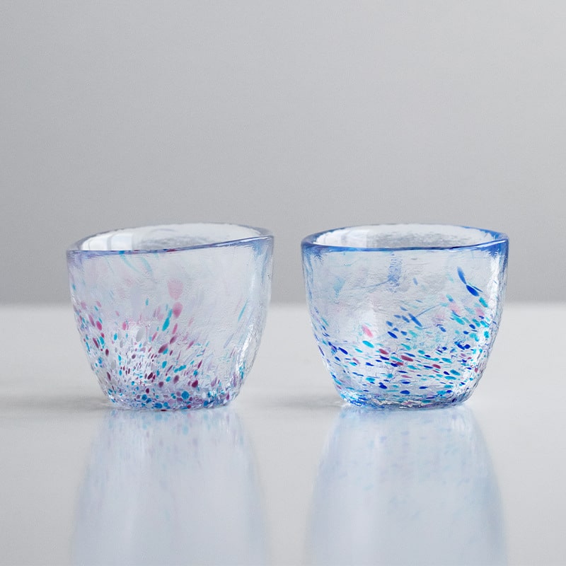 Close-up of vibrant handcrafted glass cup design.