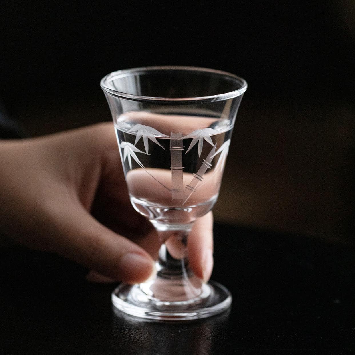 Premium crystal stemmed glass with wine being poured