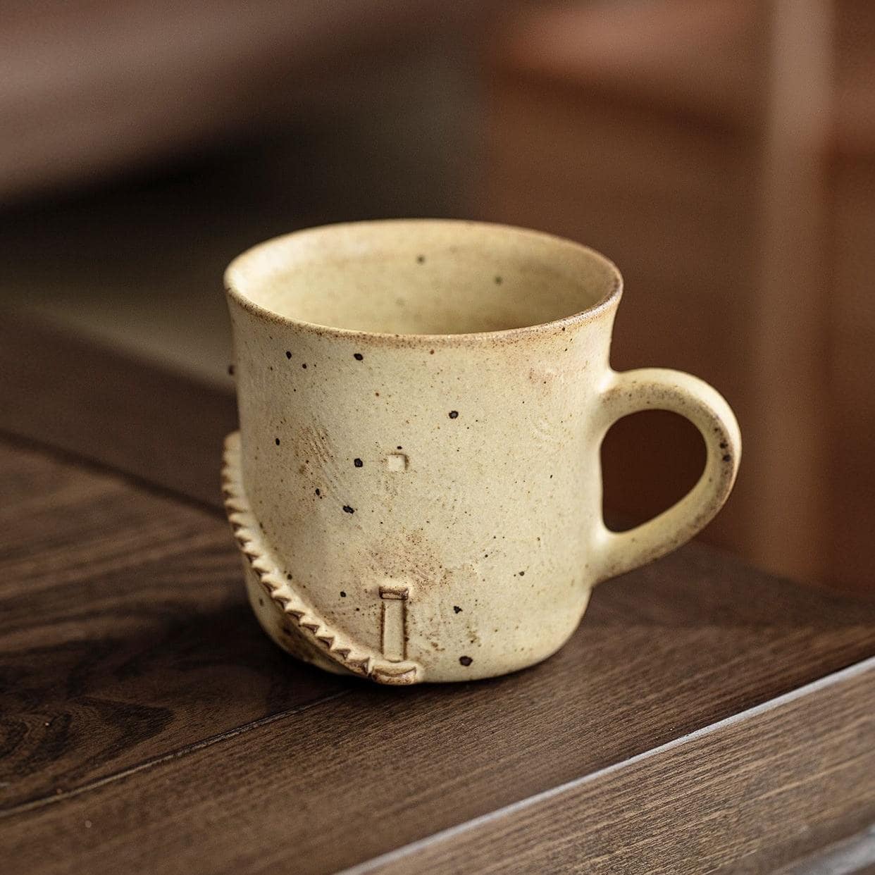 Elegant ceramic cup showcasing natural earthy tones.