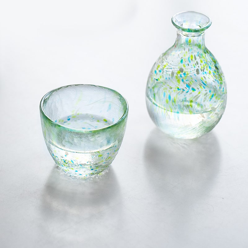 Pair of artisan glass cups featuring elegant multicolored designs.