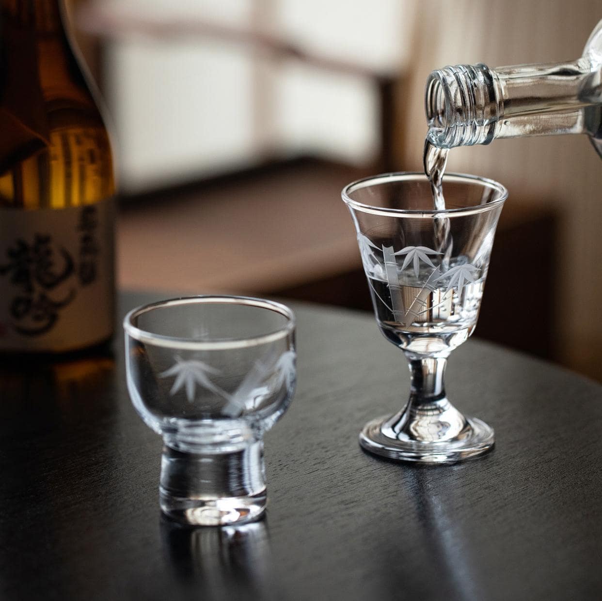 Artistic wine glass set with bamboo motif displayed on table