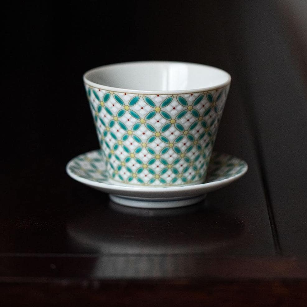 Close-up of a stylish ceramic cup showcasing intricate geometric designs.