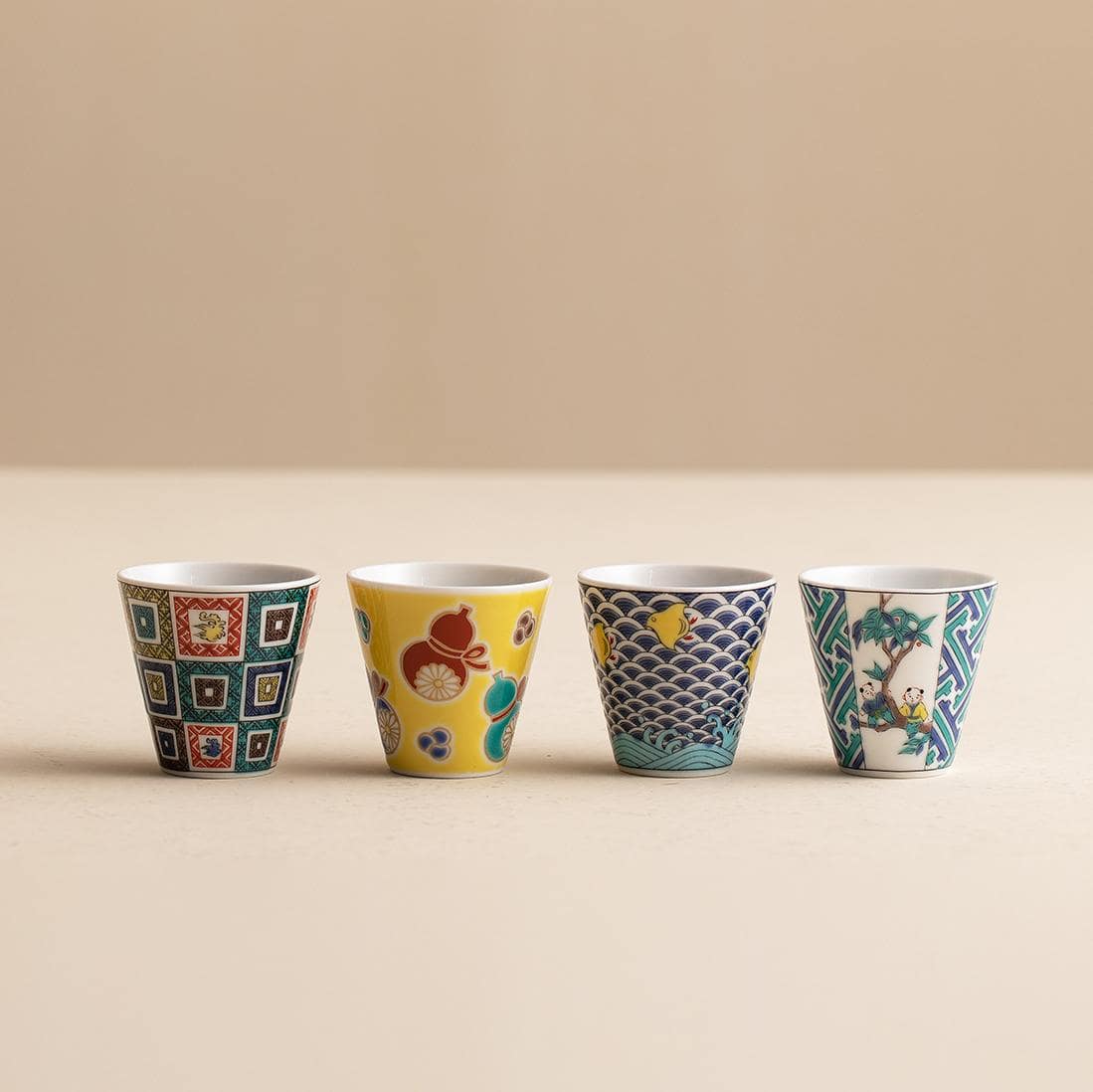 Set of Japanese porcelain cups with vibrant patterns