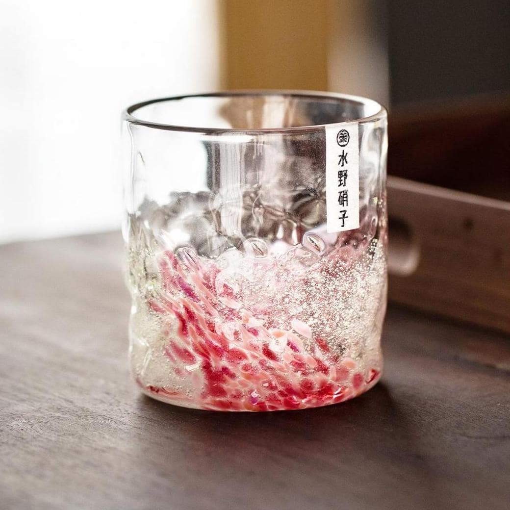 Fluorescent Japanese water cup illuminated in green.