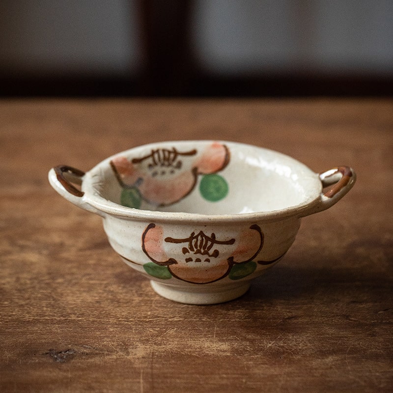 Artisan ceramic bowl set featuring traditional Japanese floral patterns.