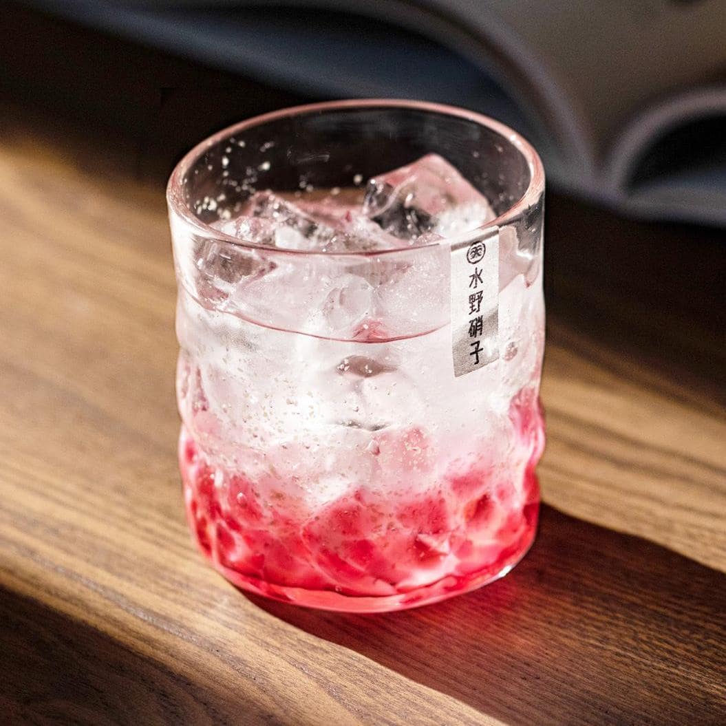 Handcrafted sakura-inspired whiskey glass for elegant use.