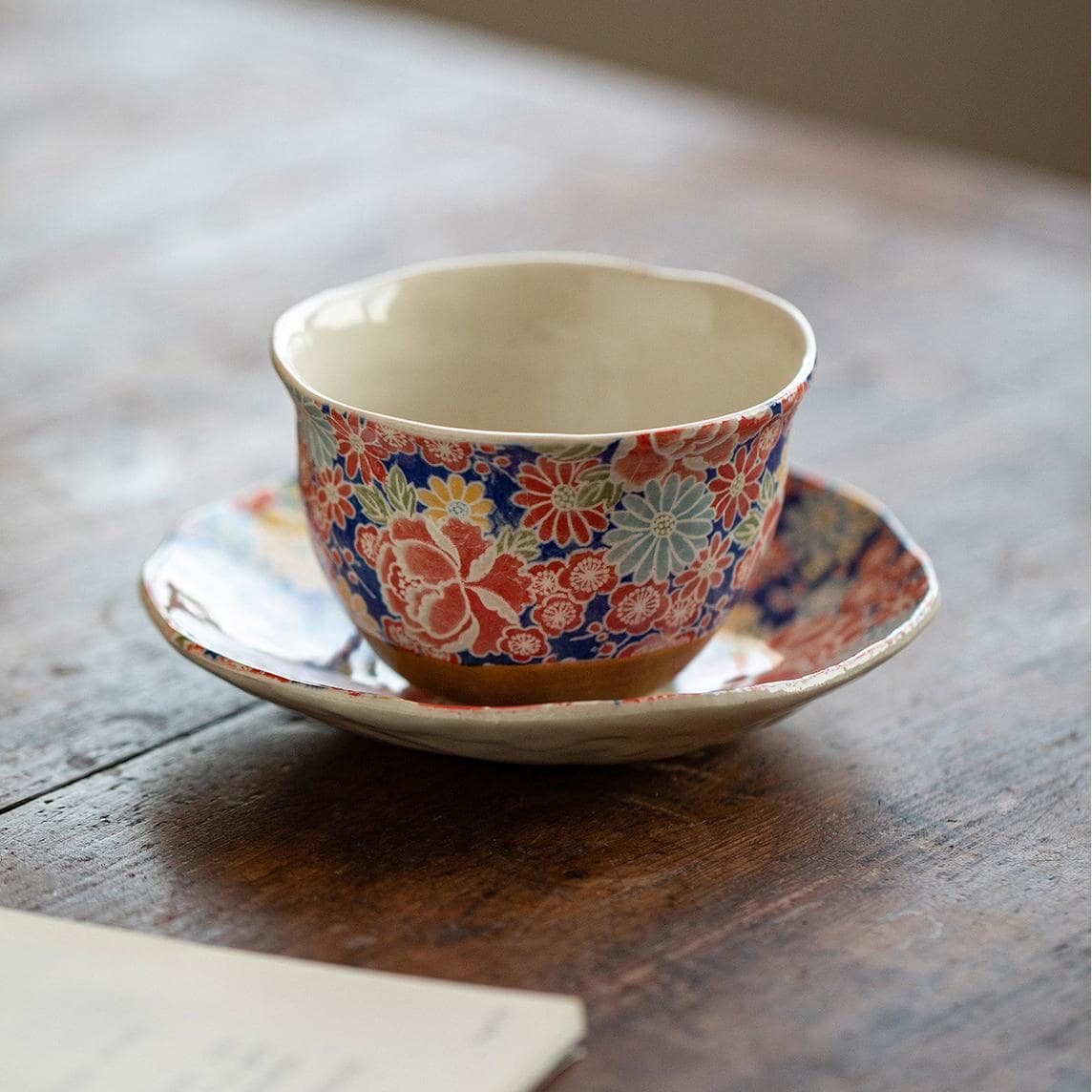 Close-up of hand-painted Japanese ceramic tea cup design