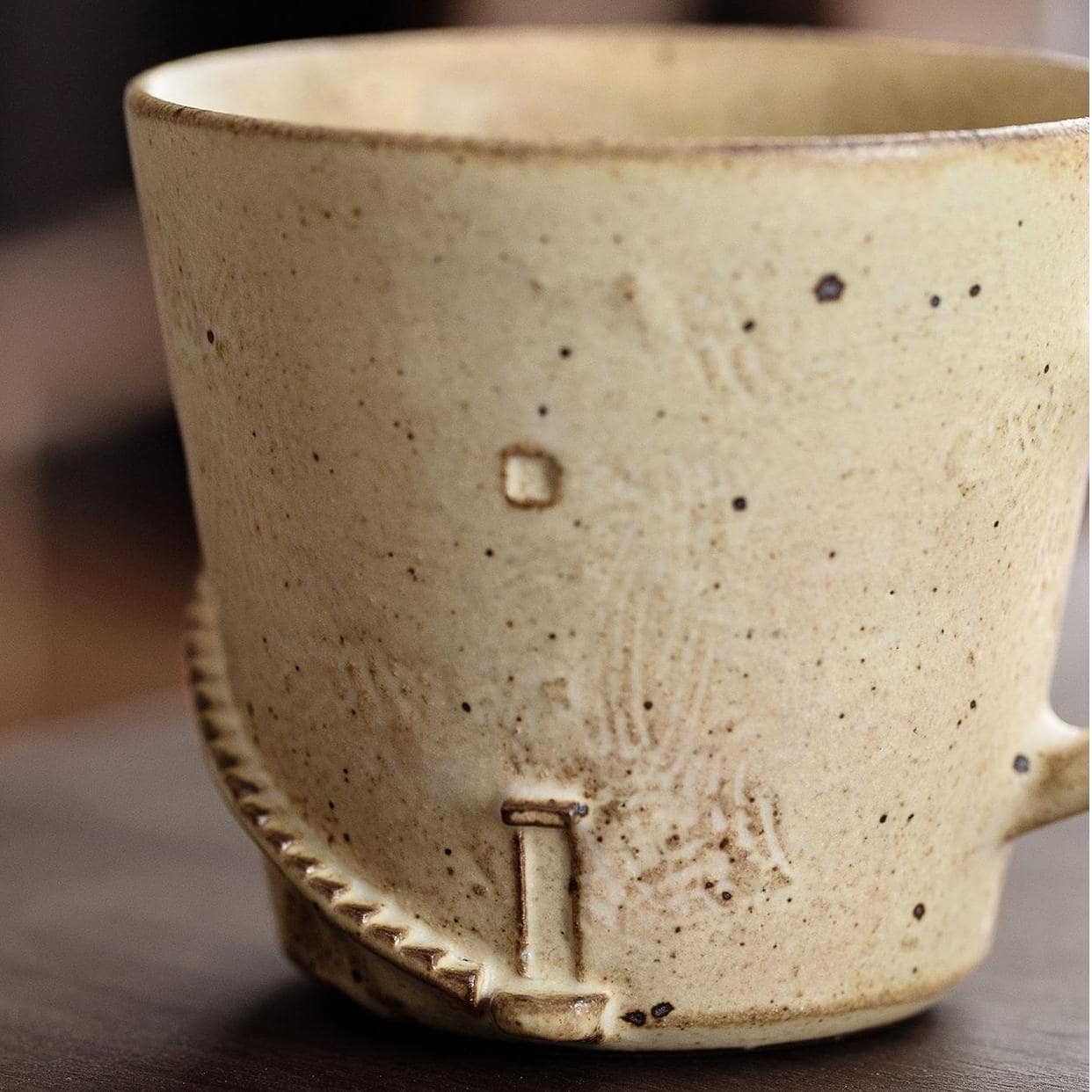 Elegant ceramic cup showcasing natural earthy tones.