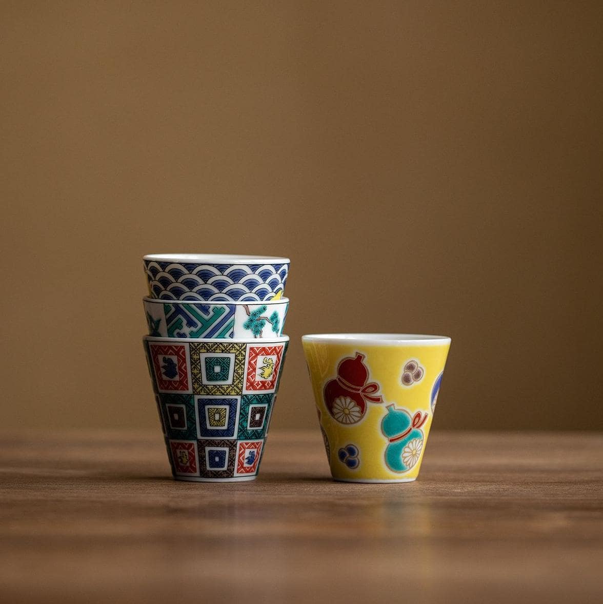 Bottom view of a Japanese porcelain cup showcasing authenticity mark