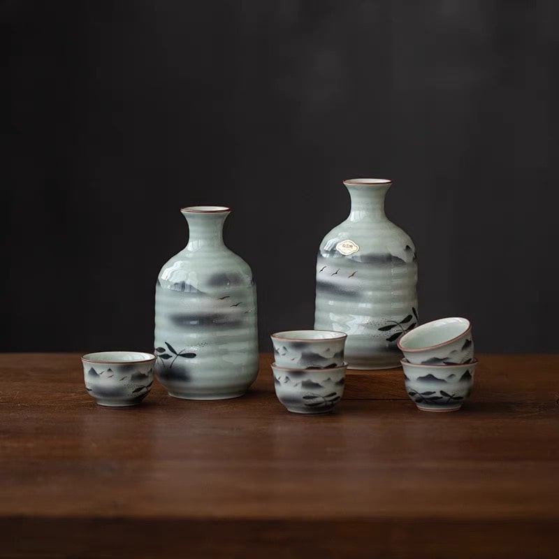 Artistic sake drinking set featuring traditional Japanese motifs.
