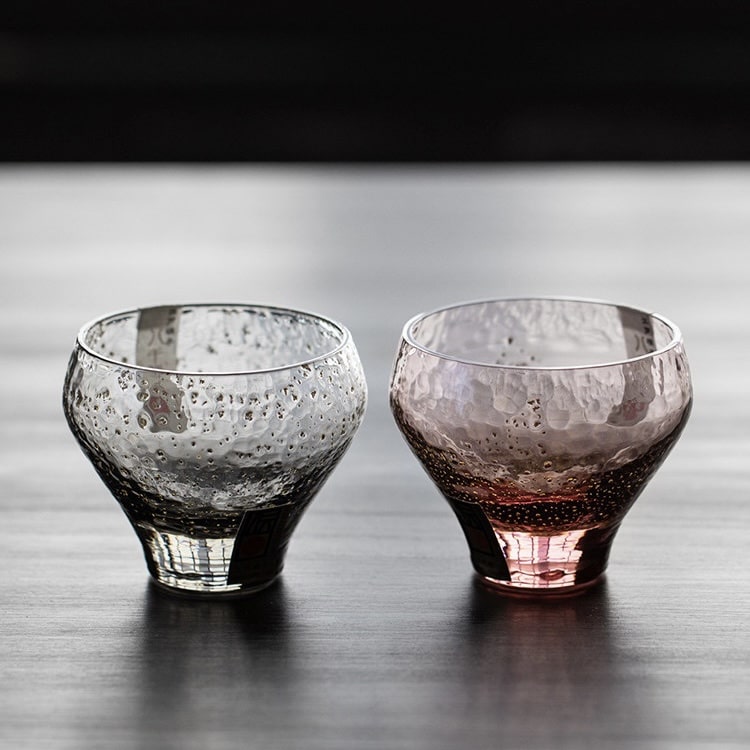 Artistic sake cups with a luxurious touch of gold detailing.
