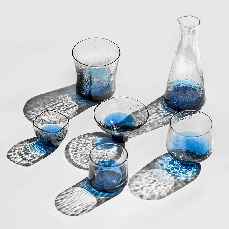 Complete glass sake set with blue gradient and gold speckled accents.
