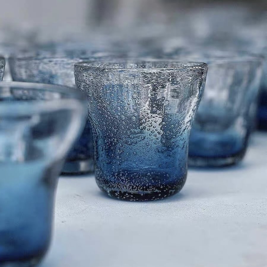 Elegant hand-blown glassware featuring a blue gradient.
