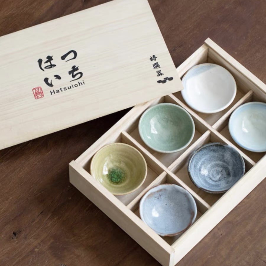 Handcrafted ceramic sake cup set in a premium wooden gift box.
