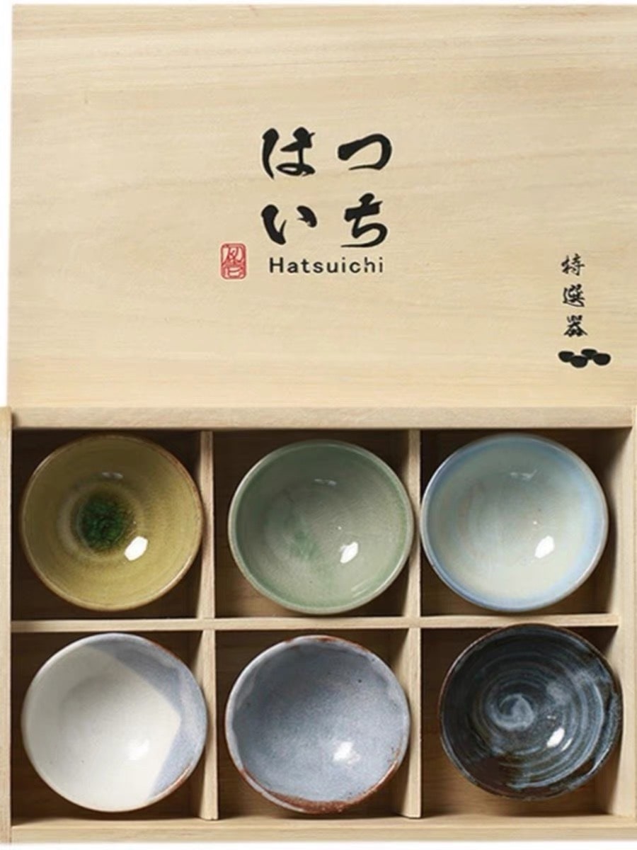 Traditional Japanese ceramic tea set in earthy tones.
