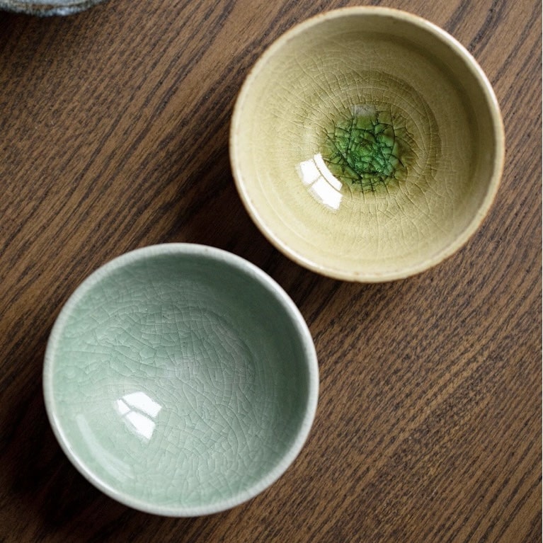 Elegant Japanese ceramic cups in earthy tones and unique glazes.
