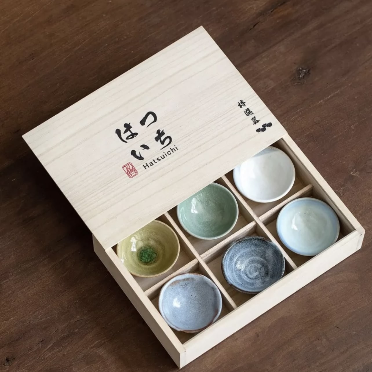 Elegant Japanese ceramic cups in earthy tones and unique glazes.
