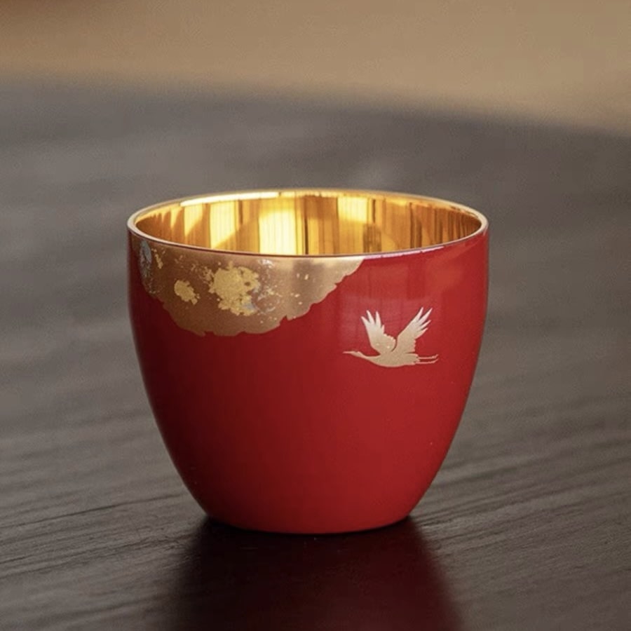 Artisan lacquer tea cups showcasing traditional Japanese craftsmanship.
