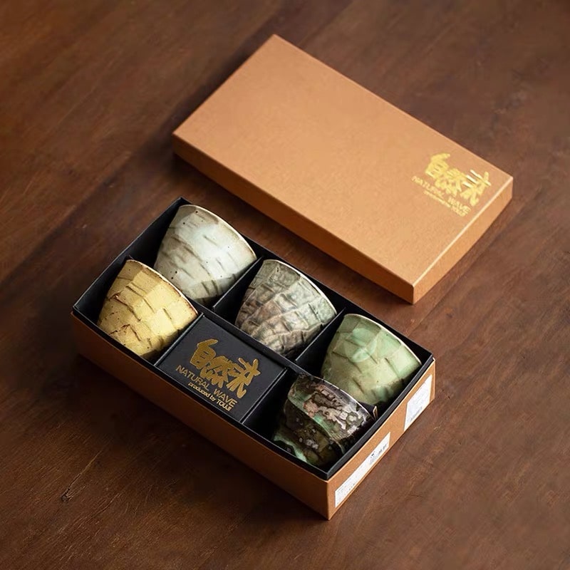 Japanese tea cup set displayed in luxurious packaging.
