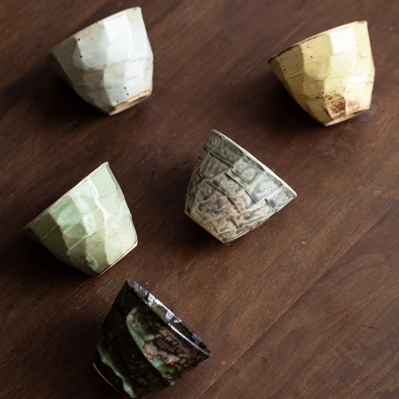 Japanese tea cup set displayed in luxurious packaging.
