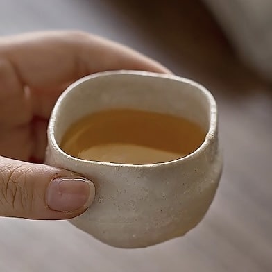 Japanese-style ceramic tea cups in a rustic design.
