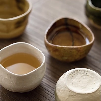 Rustic tea cup set featuring hand-glazed textures.
