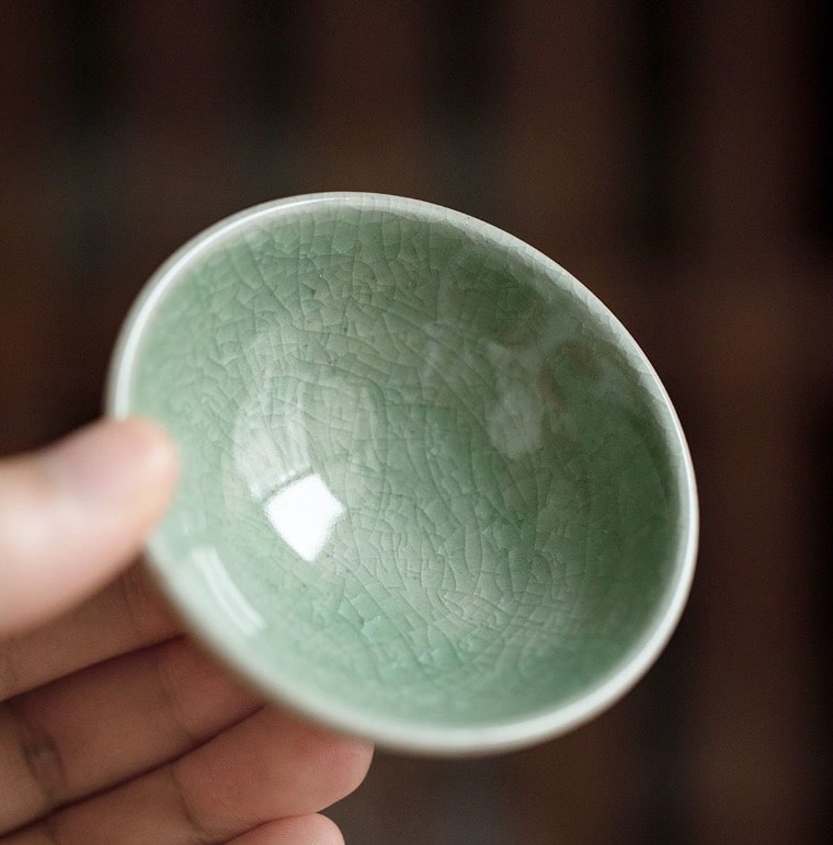 Artistic handcrafted tea cups displayed elegantly.
