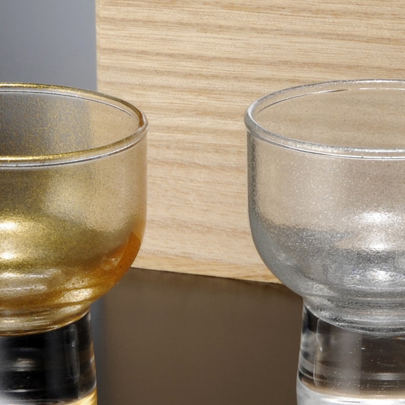 Handcrafted sake cup set displayed with a wooden box.
