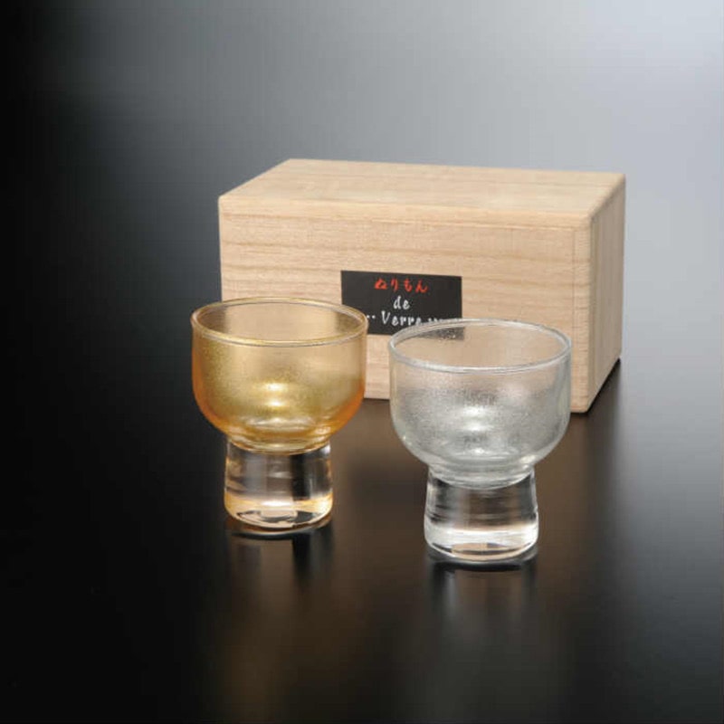 Elegant gold and silver sake cups with frosted glass finish.
