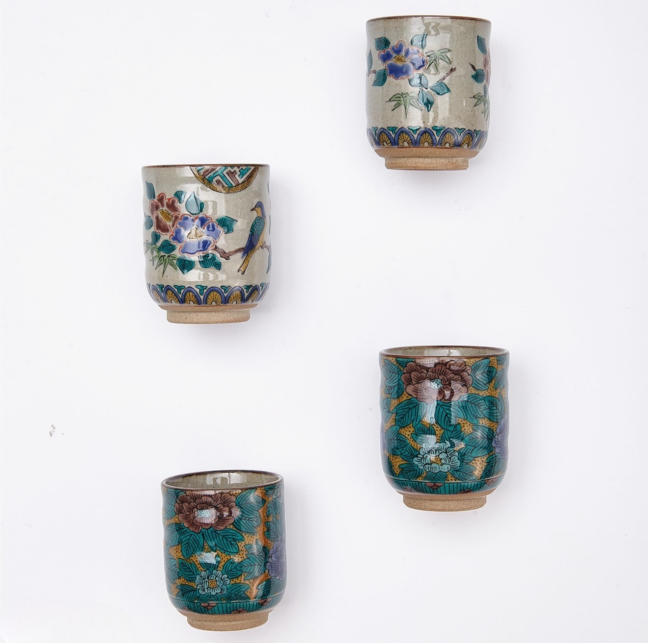 Handcrafted Japanese Ceramic Tea Cups with Bird and Floral Motif
