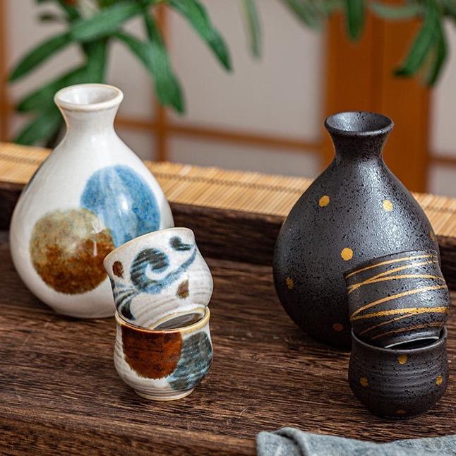 Handcrafted artisan sake set with two carafes and cups