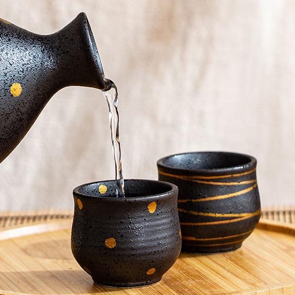 Elegant glazed ceramic sake carafe and cup set