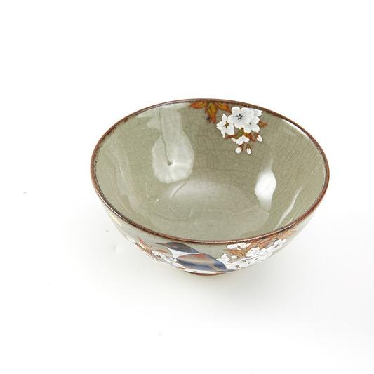 Hand-painted ceramic rice bowl with cherry blossom design.