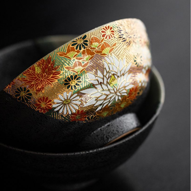 Elegant ceramic rice bowls on a wooden table.