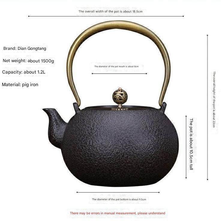 Elegant Japanese-style cast iron teapot with ergonomic brass handle.