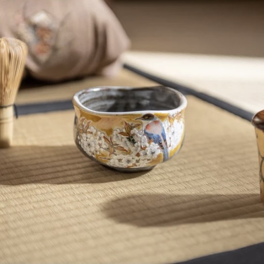 Close-up of a hand-painted ceramic tea cup