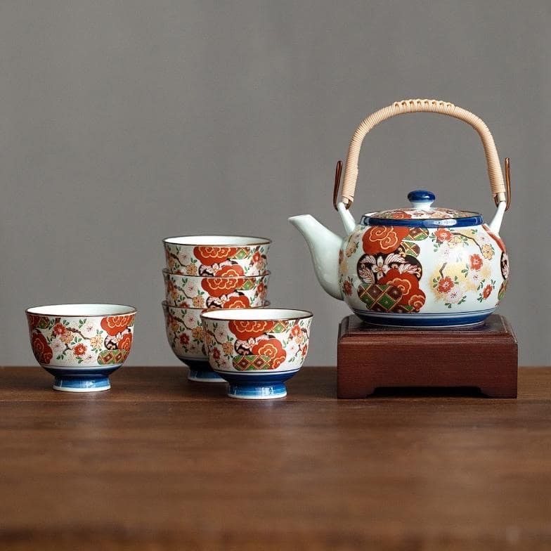 Elegant tea set with bird and flower motifs