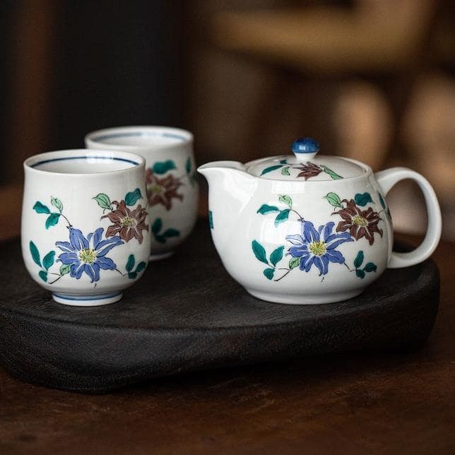 Hand-painted porcelain tea set with floral designs