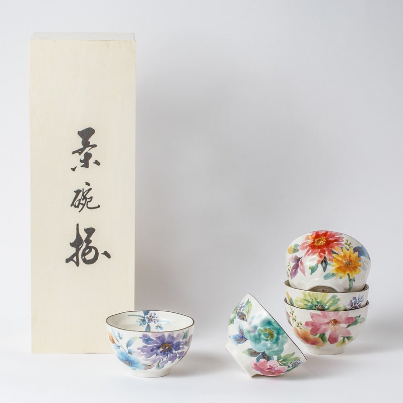 Close-up of vibrant floral designs on ceramic rice bowls.