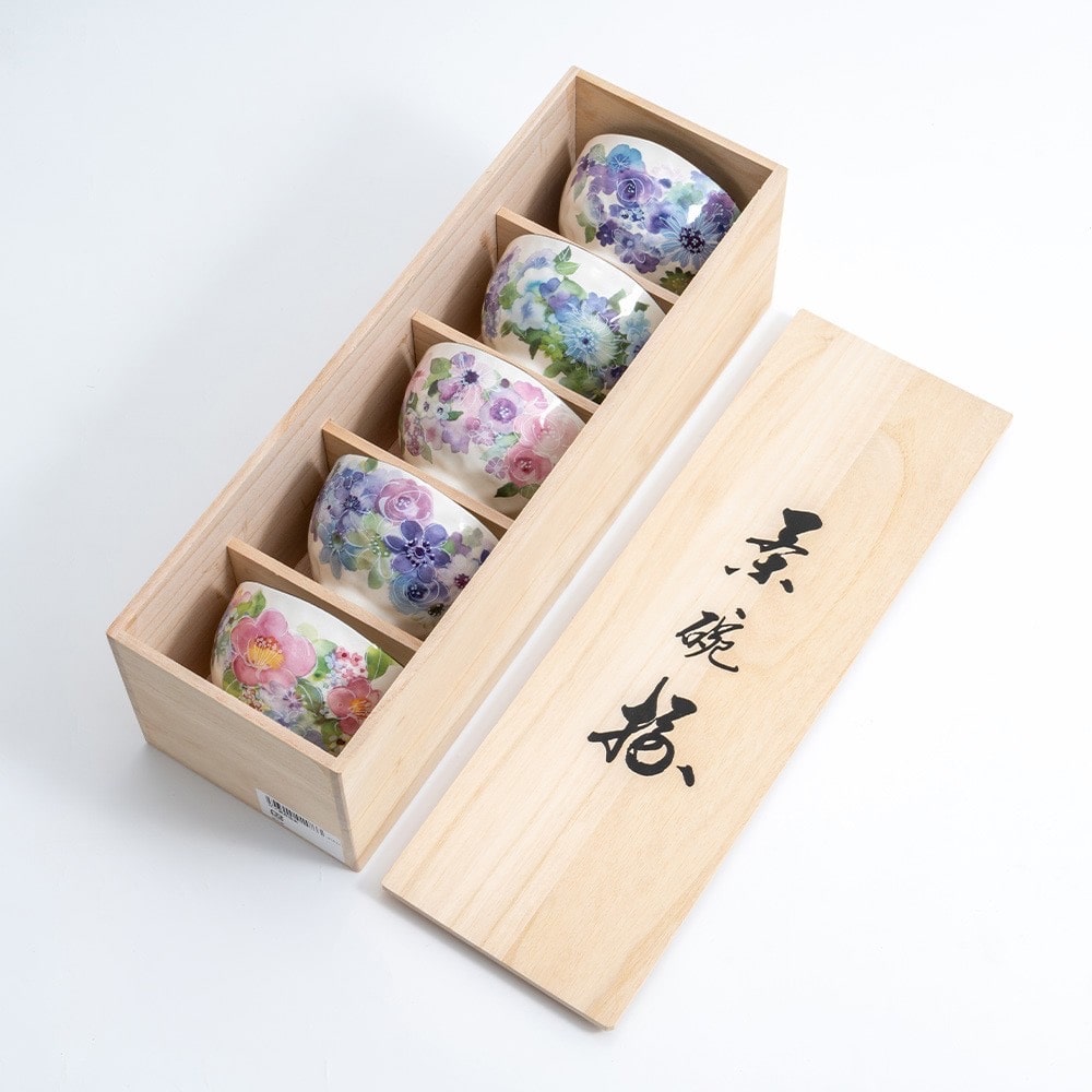 Artisan rice bowl set with unique hand-painted floral patterns.