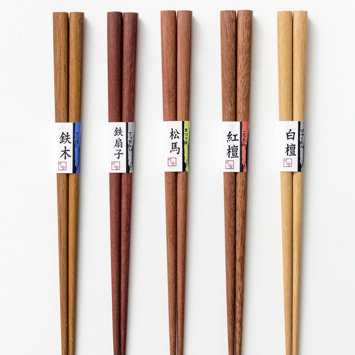 Assorted wooden Japanese chopsticks in natural finishes.