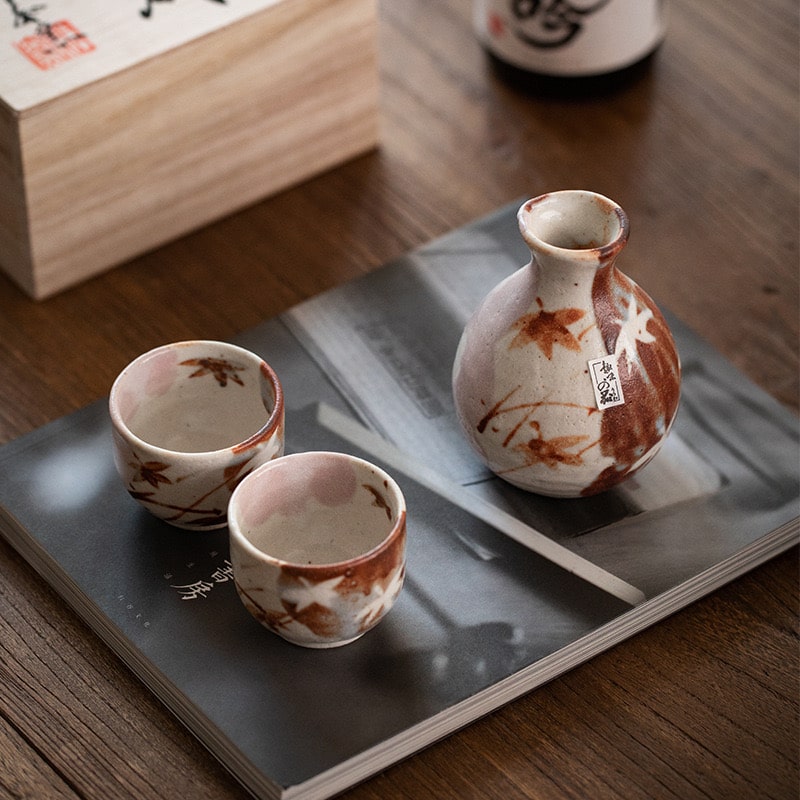 Full ceramic sake set with Tokkuri and two Ochoko cups on display